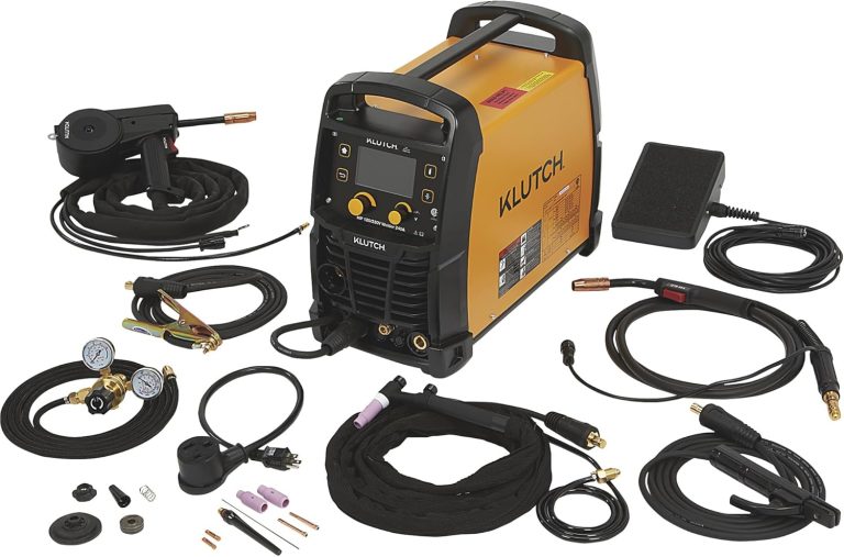 A Klutch multiprocess welder set with various attachments and accessories, including cables, gauges, and connectors, is arranged on a white background.